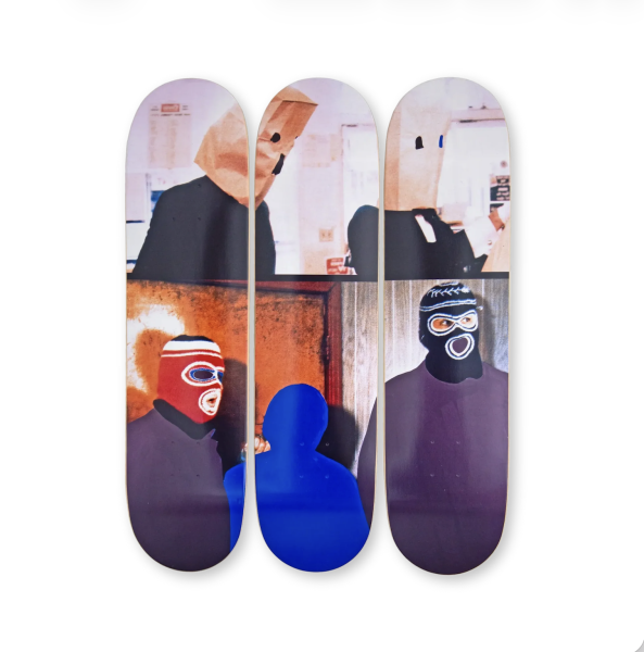 The image shows three skateboards from a collaboration, featuring designs inspired by John Baldessari’s art.